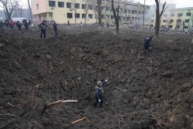 A Russian attack on a maternity hospital in Mariupol, Ukraine, left a large crater in the ground on March 9, 2022.