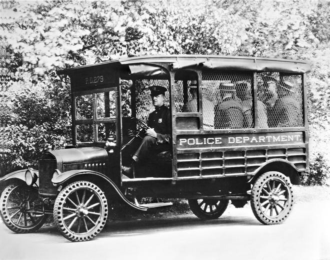 A 1925 Ford Model T used as a police transport wagon.