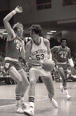 Indiana\'s Kent Benson (54) defends against Kentucky\'s Ricky Robey as Scott May, sporting a cast on his broken arm, looks on during the NCAA regional final in Dayton, Ohio, on March 22, 1975. Larry Crewell | Herald-Times