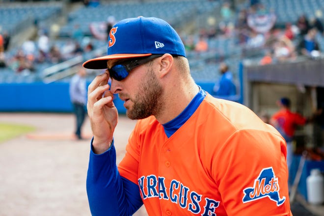 April 7: Tebow takes the field for Syracuse's game against the Pawtucket Red Sox.