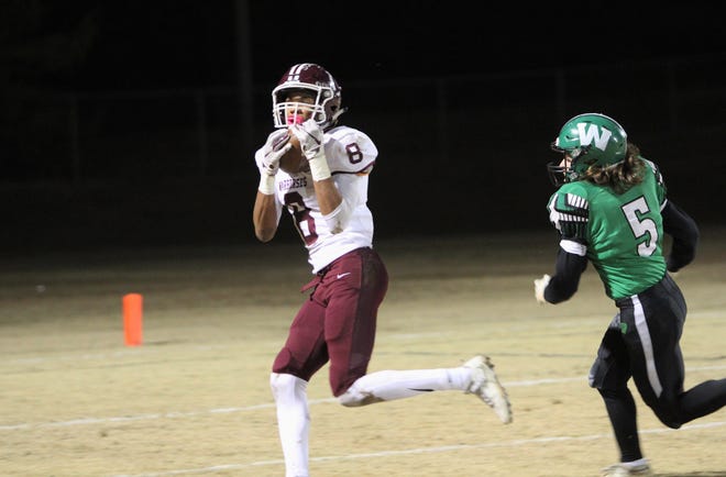 Fred Graves hauls in one of his two touchdown receptions against West Stanly on Nov. 15.