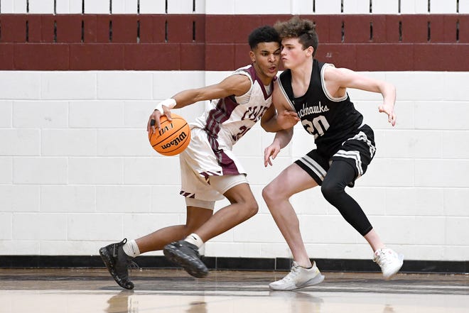 Owen's Hunter Inabinett goes up against North Buncombe's Bryce Payne during their game at Owen High School on Jan. 2, 2020.