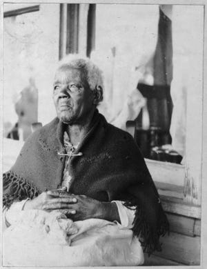 This 1937 photograph depicts Sarah Gudger, a remarkable woman who spent the first 50 years of her life enslaved. She died in 1938, purportedly at the age of 122 years old. She is buried in Swannanoa.