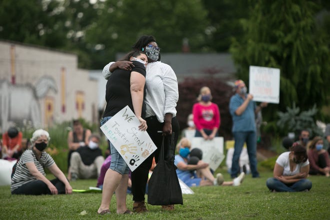 People gather at Black Mountain's Town Square on the evening of June 19, 2020, in support of the nationwide Black Lives Matter protests and in honor of Juneteenth, the holiday that celebrates the emancipation of slaves in the United States.