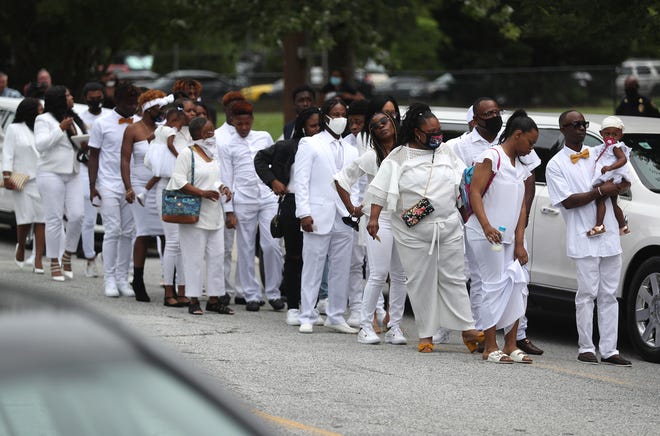 Mourners arrive for the funeral service for Rayshard Brooks.