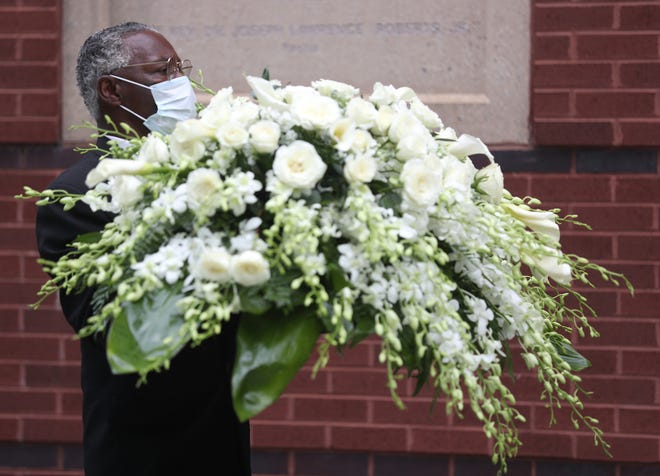 Flowers are delivered for the funeral service for Rayshard Brooks.