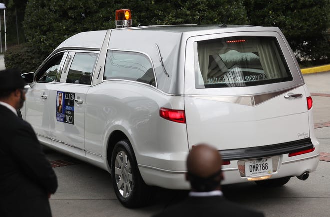 The hearse carrying the remains of Rayshard Brooks arrives at the Ebenezer Baptist Church.