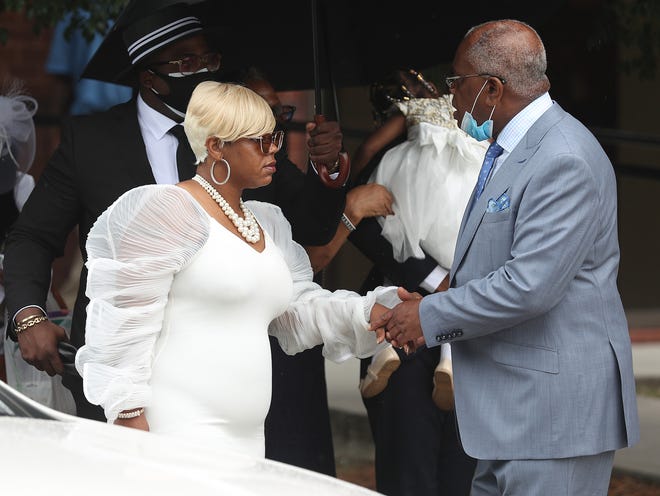 Tomika Miller arrives for the funeral service for her husband Rayshard Brooks.