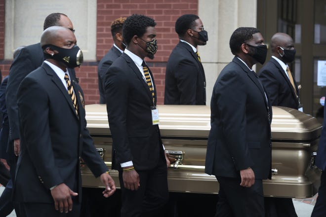 Pallbearers bring the remains of Rayshard Brooks to the Ebenezer Baptist Church for his funeral.