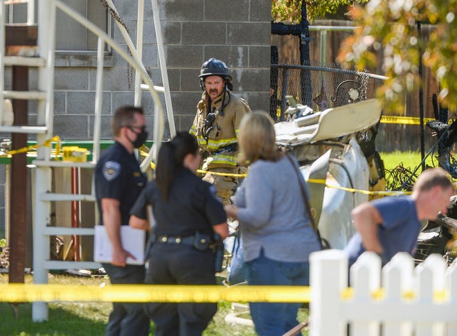 Emergency crews  respond to a small plane crash, Saturday, July 25, 2020, in West Jordan, Utah. (Leah Hogsten/The Salt Lake Tribune via AP)